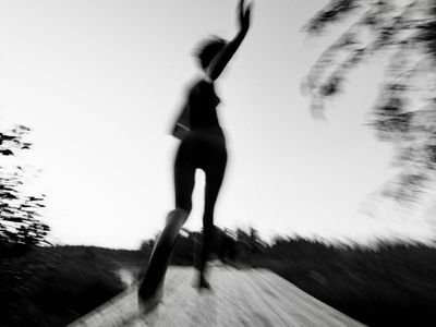 Abstract motion of a person exercising in shadows